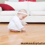 Why do some parents choose to allow their babies to crawl on the hardwood floor?