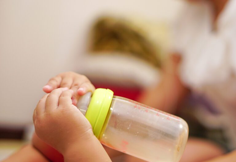 baby playing with bottle and its associated behaviour 