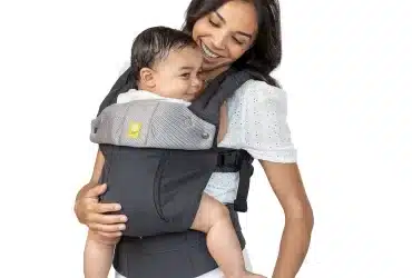 mother holding her baby in baby carrier