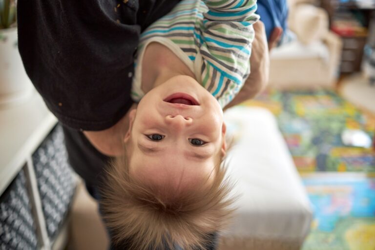 baby hangs upside down 