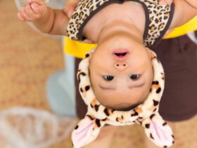 baby hangs upside down